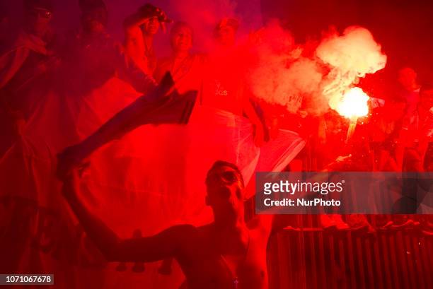 River Plates fan holds a bengal as he celebrates in the obelisk the victory of their football team,Buenos Aires, Argentina, Monday, Dec. 10, 2018....