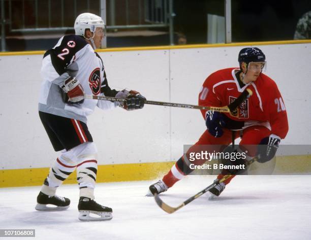 Brian Leetch of the United States is defended by Martin Prochazka of the Czech Republic during their Olympic tournament quarter-final match at the...