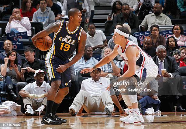 Raja Bell of the Utah Jazz against Mike Bibby of the Atlanta Hawks at Philips Arena on November 12, 2010 in Atlanta, Georgia. NOTE TO USER: User...