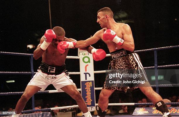 Naseem Hamed lands with a jab on the chin of Vuyani Bungu during the WBO featherweight title fight at London Olympia in London. Naseem Hamed won by a...