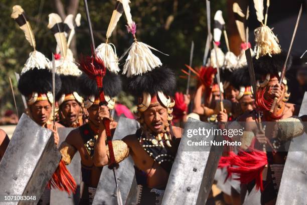 Naga tribesman from Khiamniungan tribe performs on the last day of the Hornbill festival at the Naga Heritage Village Kisama, some 10 kms away from...