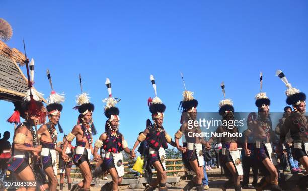 Naga tribesman from Khiamniungan tribe performs on the last day of the Hornbill festival at the Naga Heritage Village Kisama, some 10 kms away from...