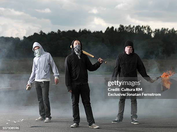 protesters in a riot - mask confrontation stock pictures, royalty-free photos & images