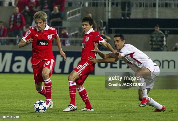 Benfica's midfielder Fabio Coentrao challenges Hapoel Tel Aviv's defender Bevan Fransman during their UEFA Champions League group B football match at...