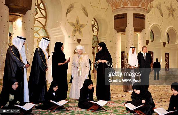 Queen Elizabeth II watches as girls read the Qur�an at the Sheikh Zayed Mosque on November 24, 2010 in Abu Dhabi, United Arab Emirates. Queen...