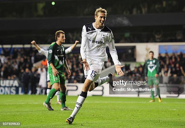 Peter Crouch of Tottenham Hotspur celebrates scoring Tottenham's third goal during the UEFA Champions League Group A match between Tottenham Hotspur...