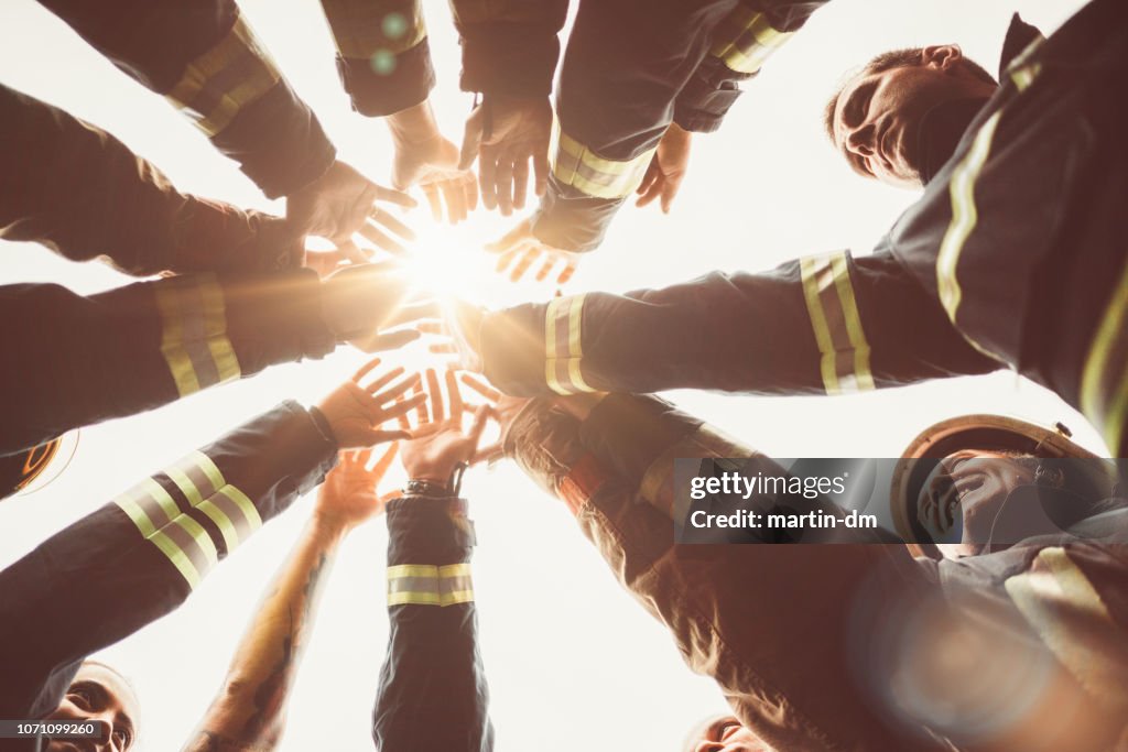 Firefighters doing high five