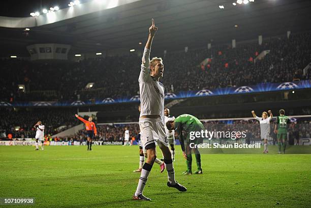 Peter Crouch of Tottenham Hotspur celebrates scoring Tottenham's third goal during the UEFA Champions League Group A match between Tottenham Hotspur...