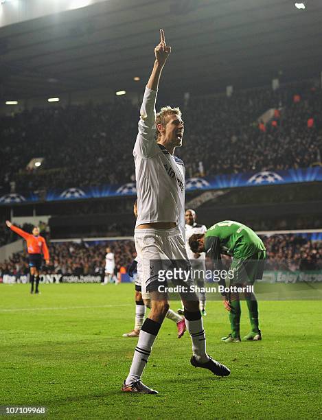 Peter Crouch of Tottenham Hotspur celebrates scoring Tottenham's third goal during the UEFA Champions League Group A match between Tottenham Hotspur...