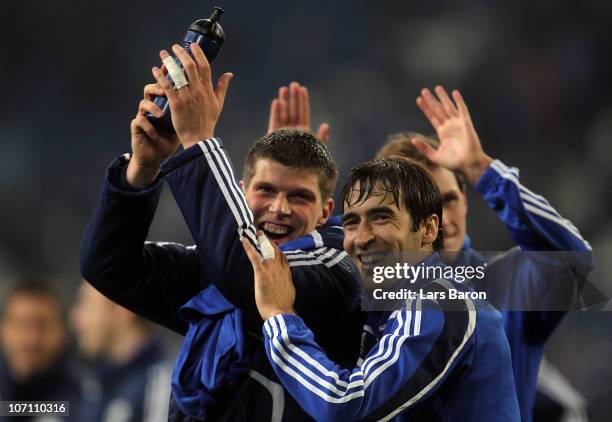 Klaas Jan Huntelaar of Schalke celebrates with Raul Gonzalez after winning the UEFA Champions League group B match between FC Schalke 04 and...