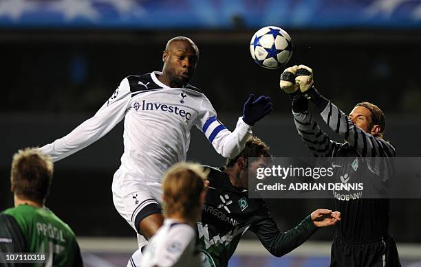 Tottenham Hotspurs' French defender William Gallas jumps to try and head the ball as Werder Bremen's goalkeeper Tim Wiese comes to punch the ball...
