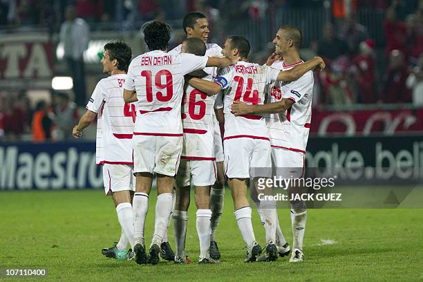 Hapoel Tel Aviv's team players jubilate after winning againts Benfica during their UEFA Champions League group B football match at Bloomfield Stadium...