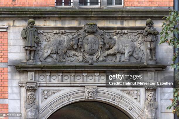 relief above the main entrance of the heinrich-zille primary school built 1901-1902, berlin, germany - heinrich zille heinrich zille stock pictures, royalty-free photos & images
