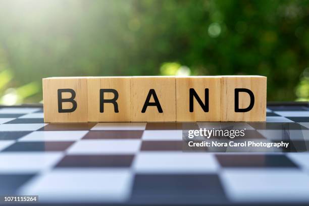 wooden block with text brand - brand name stockfoto's en -beelden