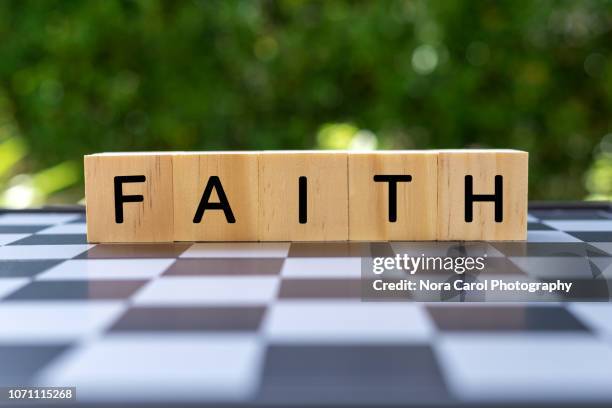 wooden block with text faith - words of support and encouragement stock pictures, royalty-free photos & images