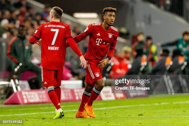 Kingsley Coman of Bayern Muechen shakes hands with Franck Ribery of Bayern Muechen during the Bundesliga match between FC Bayern Muenchen and 1. FC...