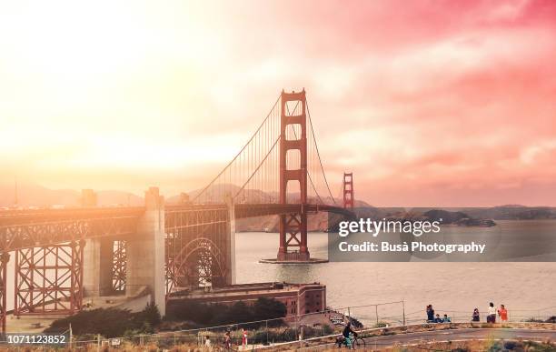 the famous golden gate bridge at sunset. san francisco, usa - golden gate bridge stock pictures, royalty-free photos & images