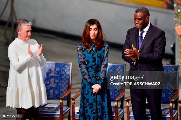 Nobel Peace Prize laureate Yazidi activist Nadia Murad is applauded by Chairman of the Norwegian Nobel Committee Berit Reiss-Andersen and Nobel Peace...