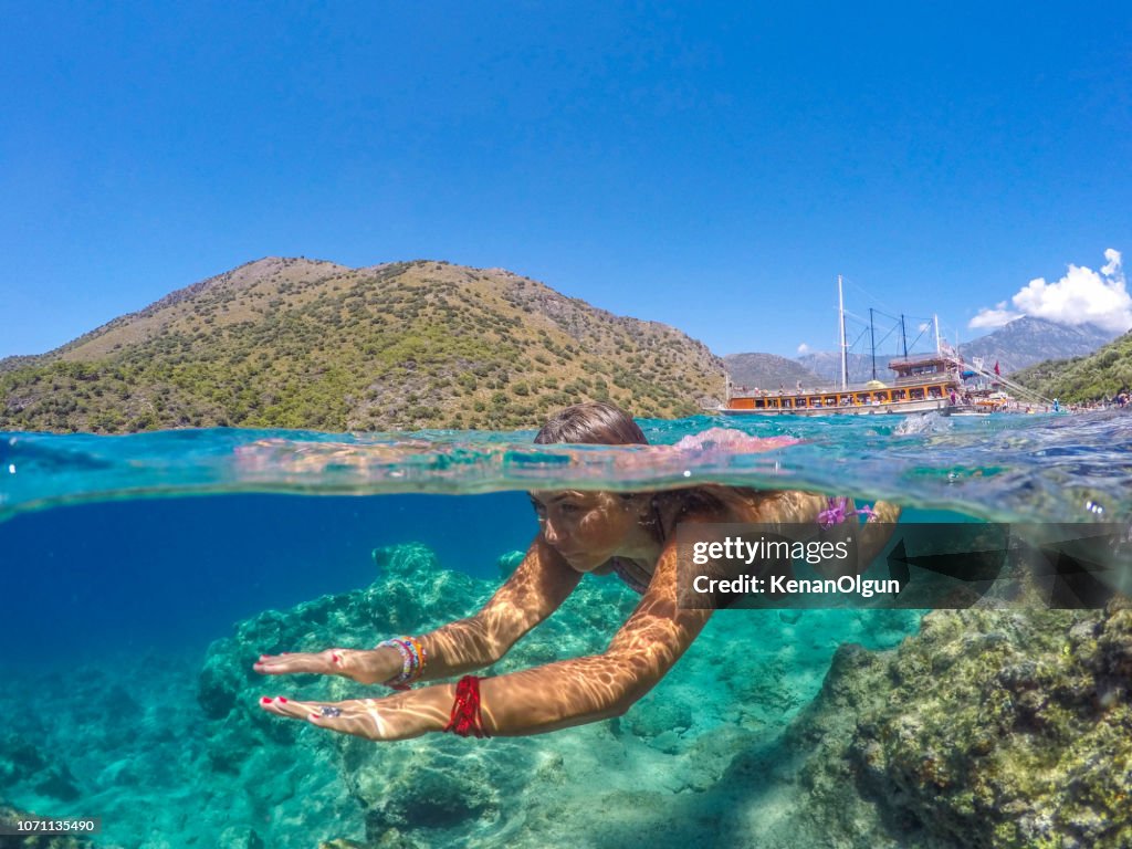 Woman enjoying swimming.