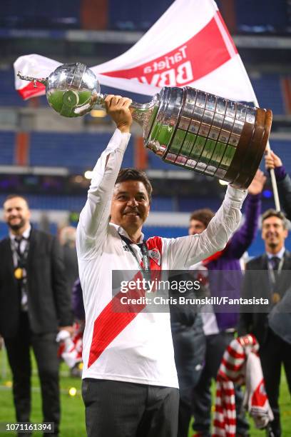 Manager of River Plate, Marcelo Gallardo celebrates with the Copa Libertadores trophy after his side won the second leg of the final match of Copa...
