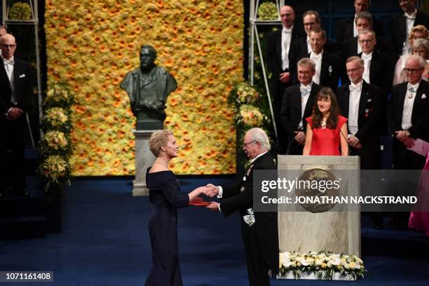 Co-laureate of the 2018 Nobel Prize in Chemistry US chemical engineer Frances Arnold, receives her Nobel Prize from King Carl XVI Gustaf of Sweden...