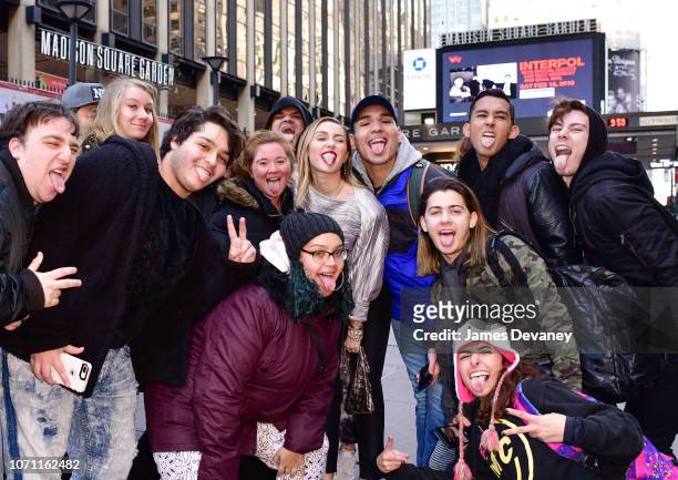Miley Cyrus poses with fans outside Madison Square Garden on December 10, 2018 in New York City.