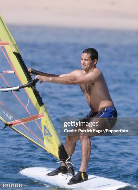 Adam Hollioake of England tries windsurfing during the England training tour in Lanzarote, 9th November 1997.