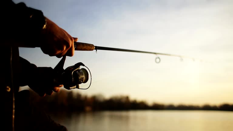 https://media.gettyimages.com/id/1071193672/video/fishing-on-the-lake-at-sunset-a-young-man-is-fishing-for-spinning-against-the-background-of.jpg?b=1&s=640x640&k=20&c=x_LK1P4_rZyWG04kDkf0fgnCoTXCmg1czv1JHFzrgyU=