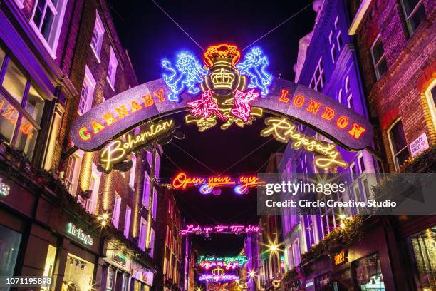 carnaby street, christmas shopping, london - carnaby street stock pictures, royalty-free photos & images