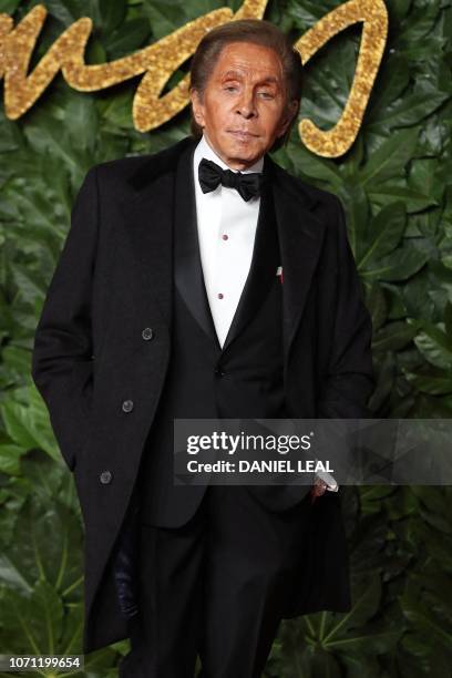 Italian fashion designer Valentino Garavani poses on the red carpet upon arrival to attend the British Fashion Awards 2018 in London on December 10,...