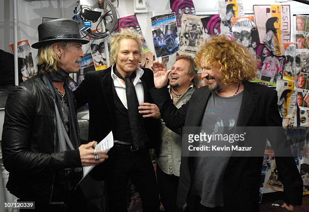 Duff McKagan and Matt Sorum of Velvet Revolver, presenters, with Michael Anthony and Sammy Hagar of Van Halen, inductees *EXCLUSIVE*