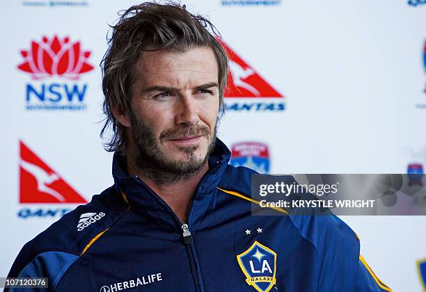 English football star David Beckham speaks to the media upon his arrival with his club, the US Major League Soccer team LA Galaxy, at the Qantas...