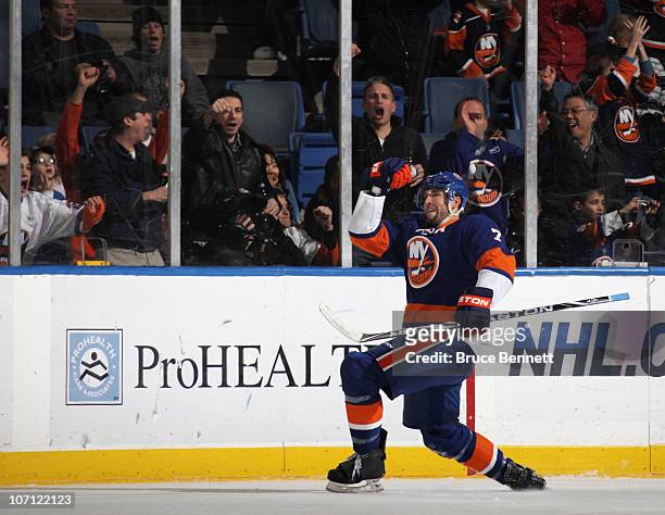 Trent Hunter of the New York Islanders scores at 10:16 oif the first period against the Columbus Blue Jackets at the Nassau Coliseum on November 24,...