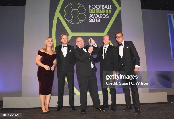 Of The Year award winner Andy Holt of Accrington Stanley poses with with presenters Hayley McQueen and Ed Chamberlin during the Football Business...