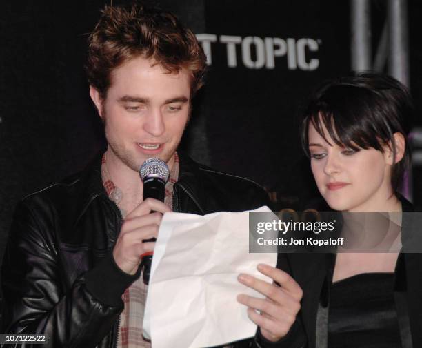 Actor Robert Pattinson and actress Kristen Stewart speak at "The Twilight Saga: New Moon" - Cast Tour at Hot Topic on November 6, 2009 in Hollywood,...