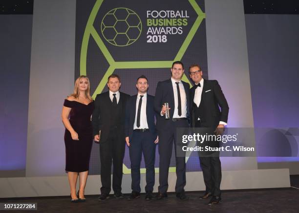 Staff from Norwich City Football Club, Winners of the 'Sponsorship / Partnership Of The Year' award, on stage with Hayley McQueen and Ed Chamberlin...