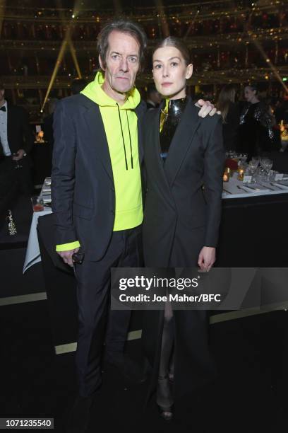 Robie Uniacke and Rosamund Pike attend The Fashion Awards 2018 In Partnership With Swarovski at Royal Albert Hall on December 10, 2018 in London,...