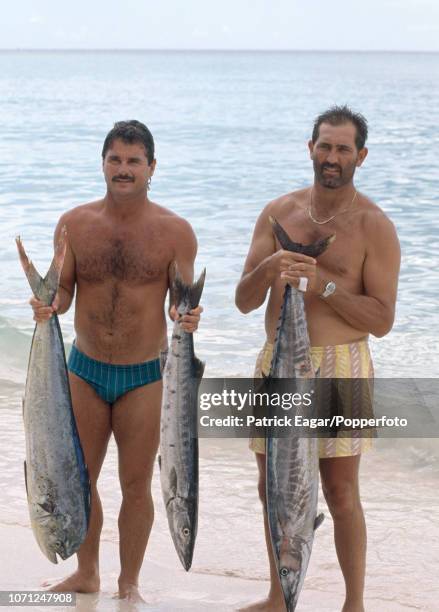 England batsmen Allan Lamb and Graham Gooch pose with the catch of the day during the rest day of the 4th Test match between West Indies and England...