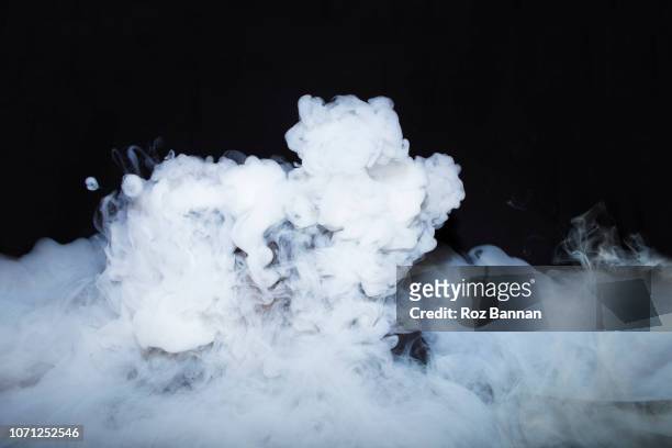 dry ice in a cauldron - nebel stock-fotos und bilder