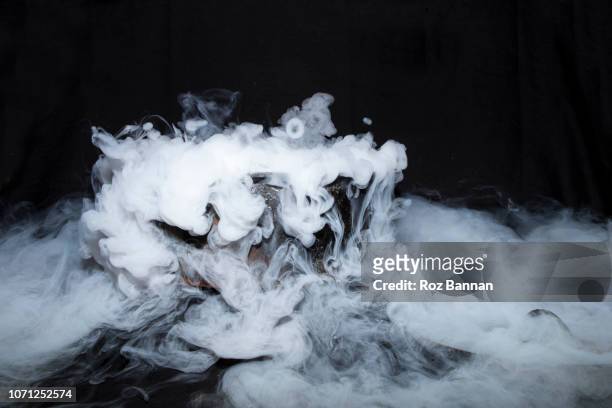 dry ice in a cauldron - dry ice stock pictures, royalty-free photos & images