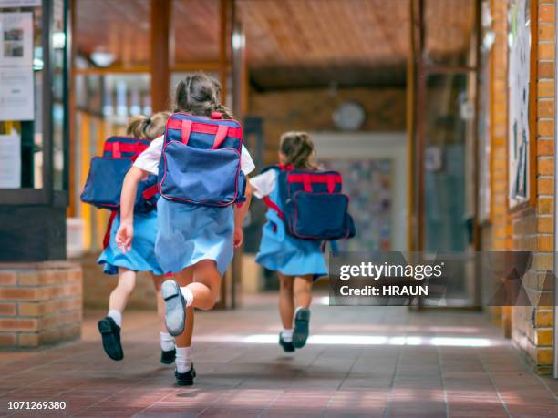 excited students running towards entrance - kids open backpack stock pictures, royalty-free photos & images