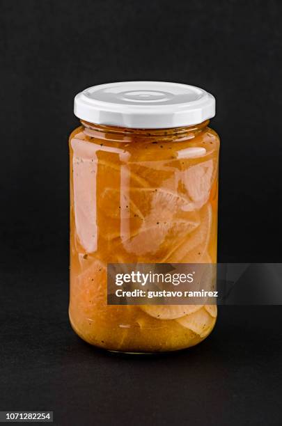 jar of pickled vegetables with on black background - pickle jar imagens e fotografias de stock