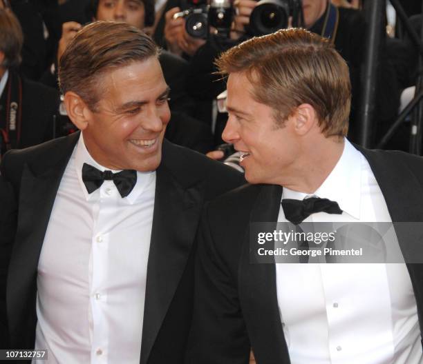 George Clooney and Brad Pitt during 2007 Cannes Film Festival - "Ocean's Thirteen" Premiere at Palais des Festivals in Cannes, France.