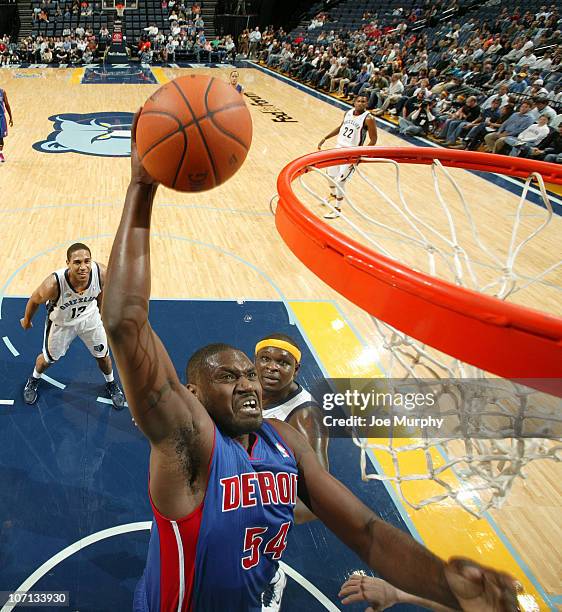 Jason Maxiell of the Detroit Pistons dunks against Zach Randolph of the Memphis Grizzlies on November 24, 2010 at FedExForum in Memphis, Tennessee....