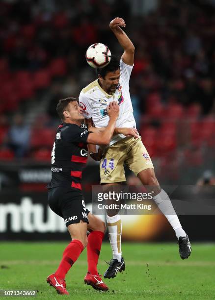 Nikolai Topor-Stanley of the Jets is challenged by Oriol Riera of the Wanderers during the round five A-League match between the Western Sydney...