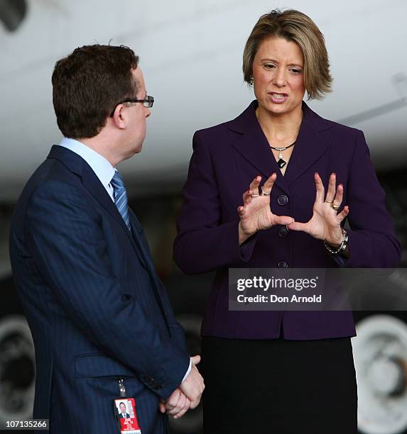 Alan Joyce speaks with Premier Kristina Keneally at Sydney International Airport on November 25, 2010 in Sydney, Australia.