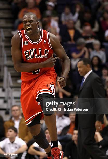 Luol Deng of the Chicago Bulls celebrates after scoring against the Phoenix Suns late in overtime of the NBA game at US Airways Center on November...