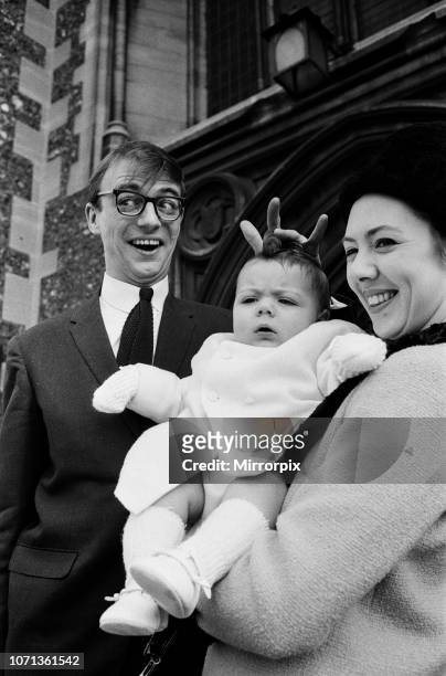 Maxwell, the son of Roy Hudd and his wife Ann, is christened at Croydon Parish Church; Max is pictured with his parents, 28th February 1965.