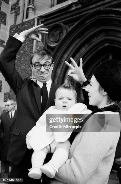 Maxwell, the son of Roy Hudd and his wife Ann, is christened at Croydon Parish Church; Max is pictured with his parents, 28th February 1965.