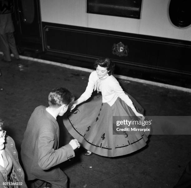 Bill Haley on his first visit to England which was largely sponsored by the Daily Mirror, Fan Marie Imiah from Glasgow wearing her Rock around the...